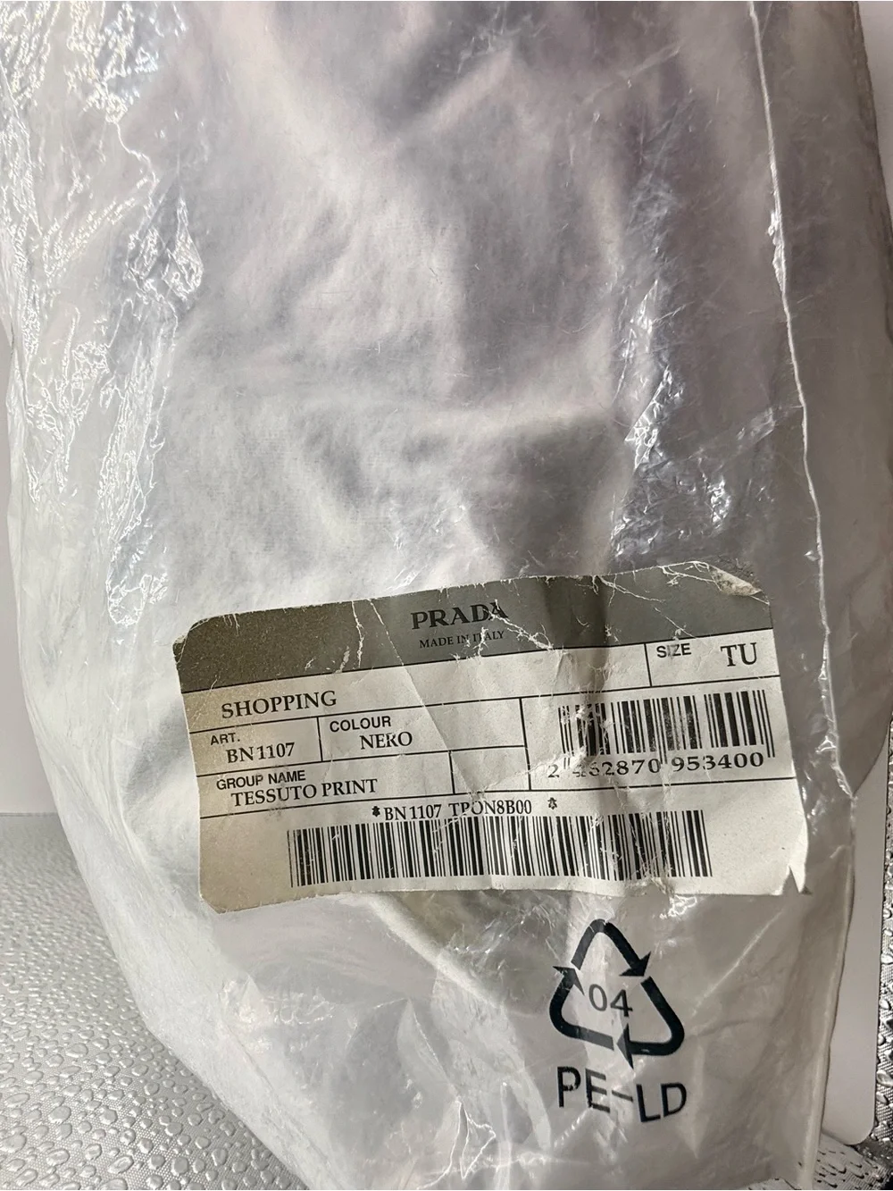 Prada Black Nylon & Leather Bag with Embossed Prada logo.
